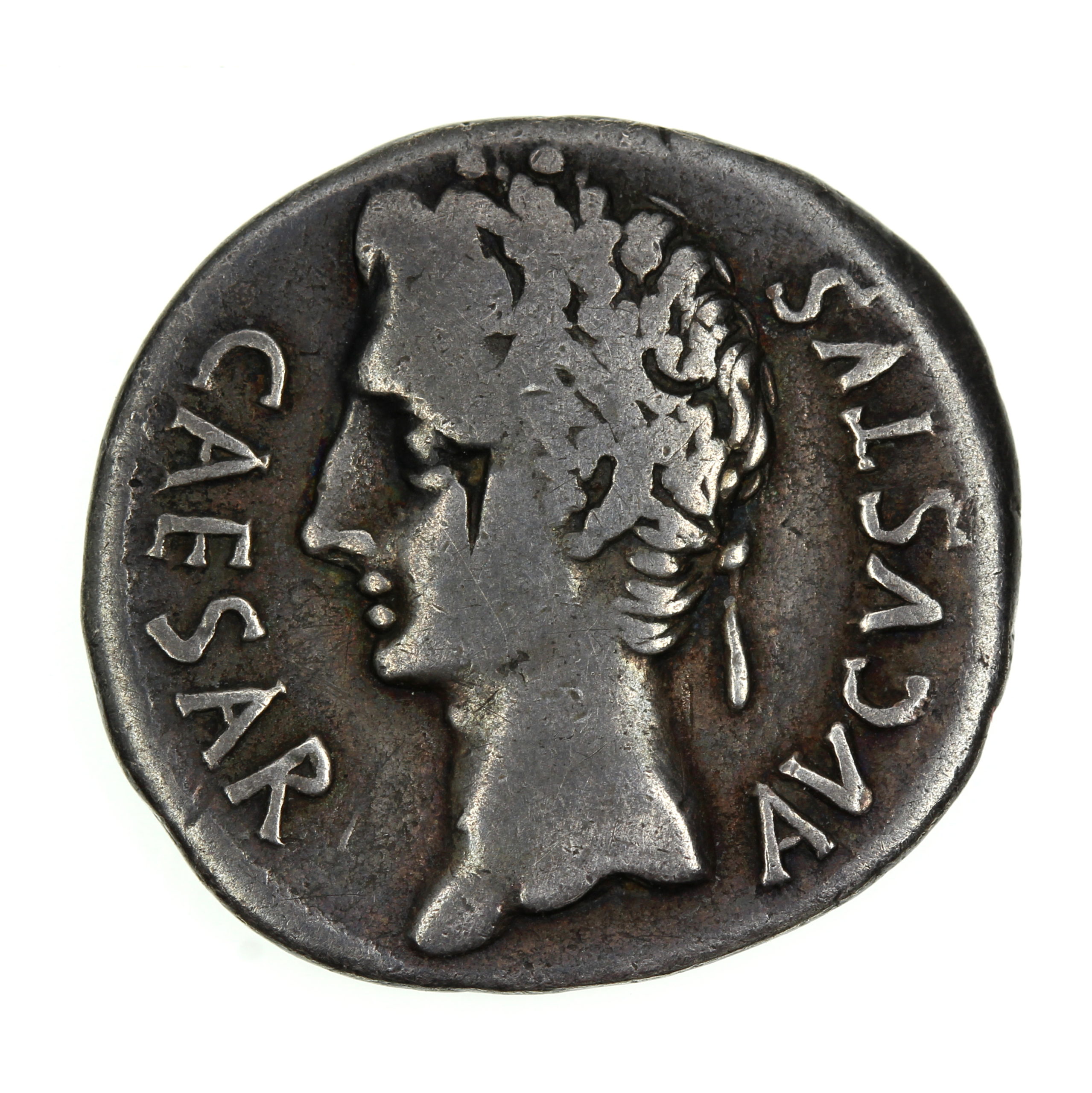 A Roman coin circa 14AD with a profile and the words Caesar Augustus